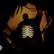 An image of a shadow puppet, a man with his ribcage lit from the back, from Nia DaCosta's Candyman.